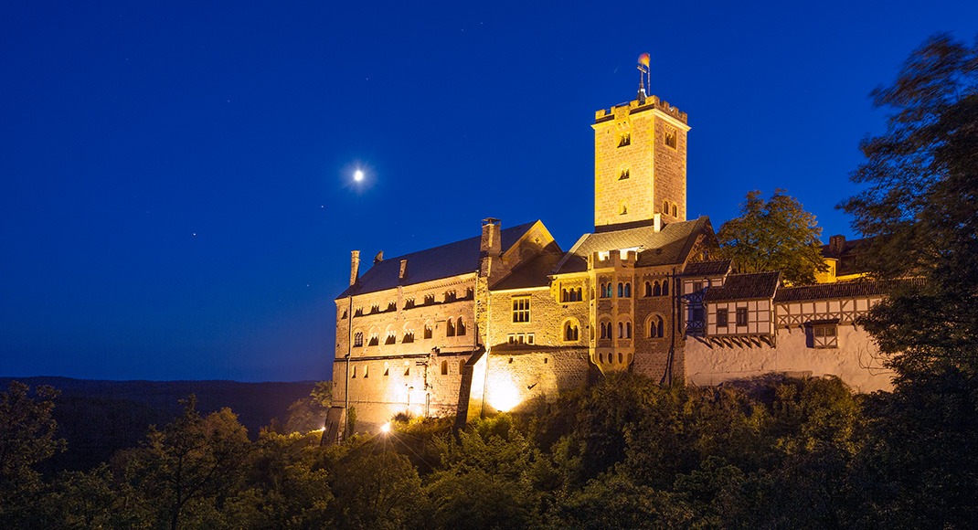 Castle at night in Eisenach with moon in the sky